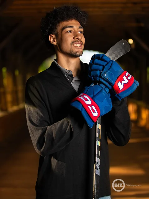 Christian in hockey gear for a dramatic personalized portrait
