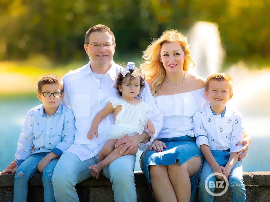 Family seated together outdoors for a group portrait